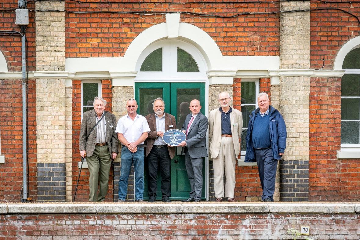 The unveiling group at Appledore with the plaque